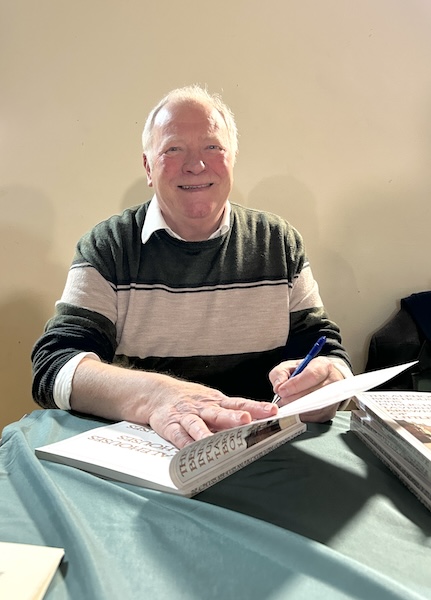 Author John Goodge of The Littleport Society,  signing copies of his new book, February 2025.